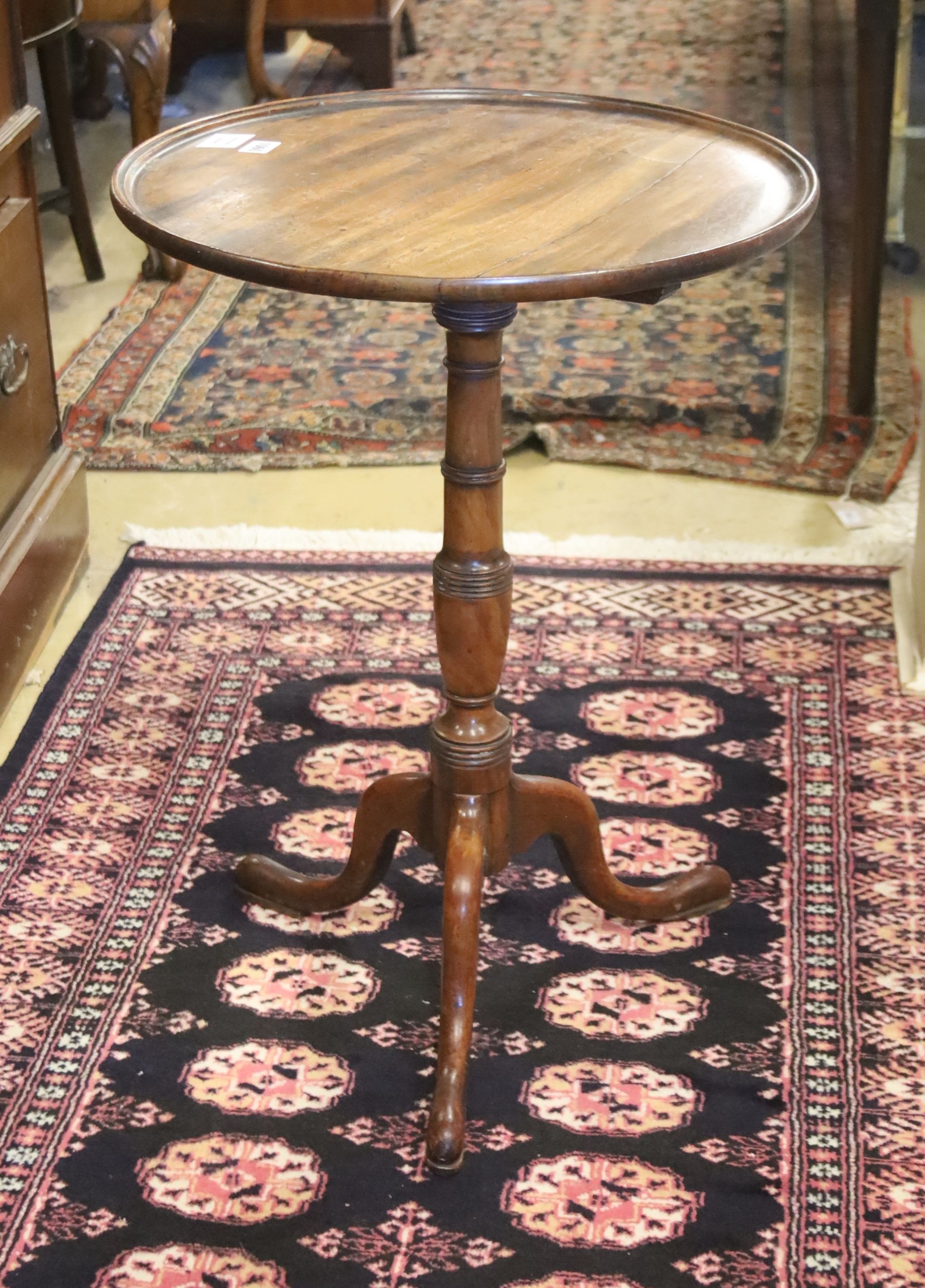 A George III mahogany dish topped wine table on tripod base, diameter 49cm, height 68cm